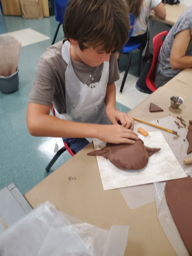 boy working with clay